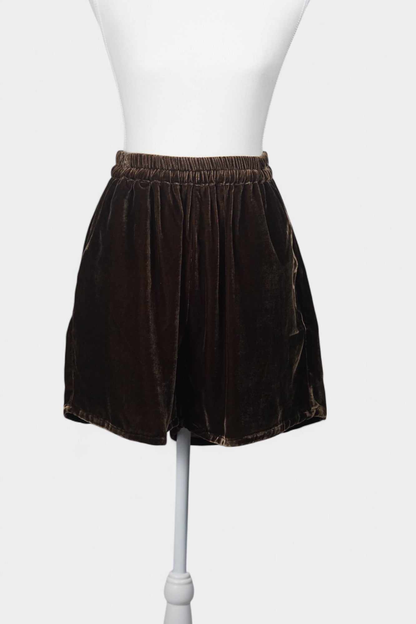 Luxe chocolate silk velvet shorts featuring soft texture and gathered waist.