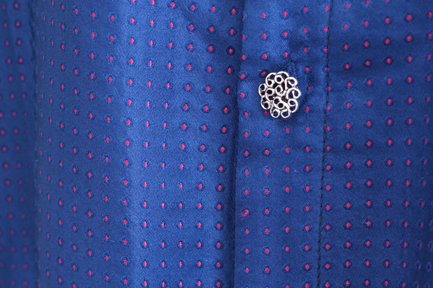 Navy blue Song Brocade silk dress featuring subtle red dotted pattern and ornamental buttons.