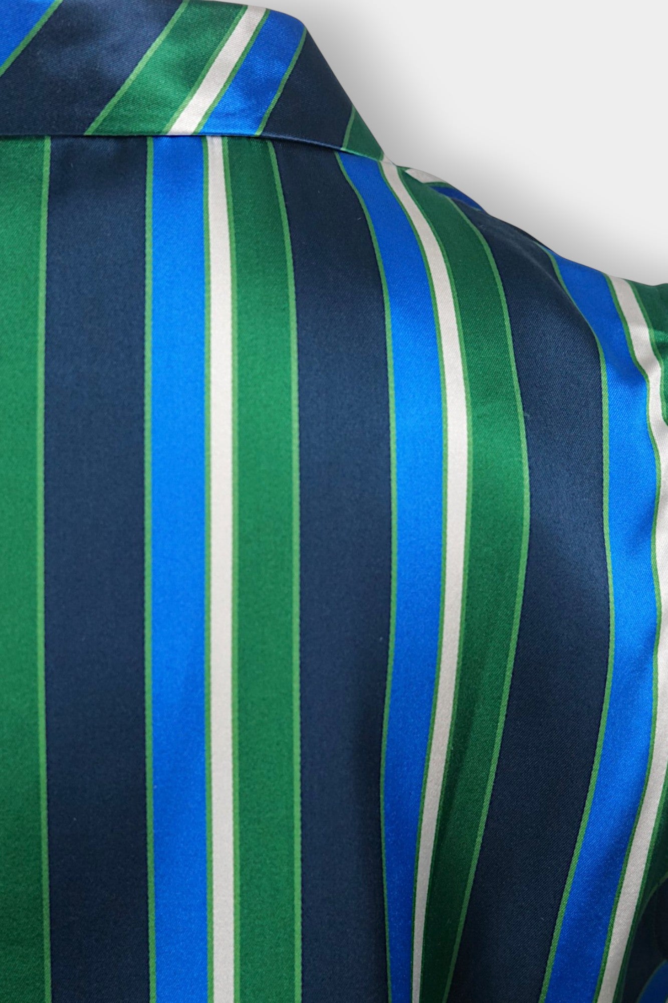 Lustrous Song Brocade V-neck top with collar, displaying intricate blue, green, and white vertical stripes