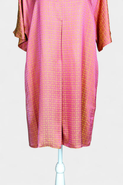 Women's pink and gold Song Brocade dress with a geometric lattice pattern and V-neckline on a mannequin