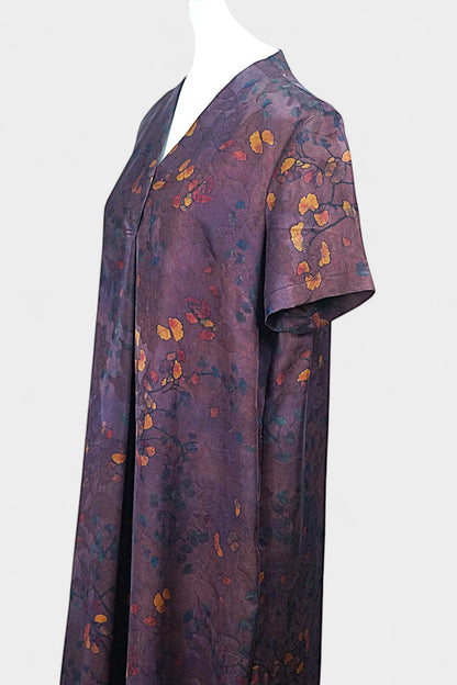 Aubergine purple Xiangyun Sha silk dress featuring a scattered autumn leaf print and V-neckline
