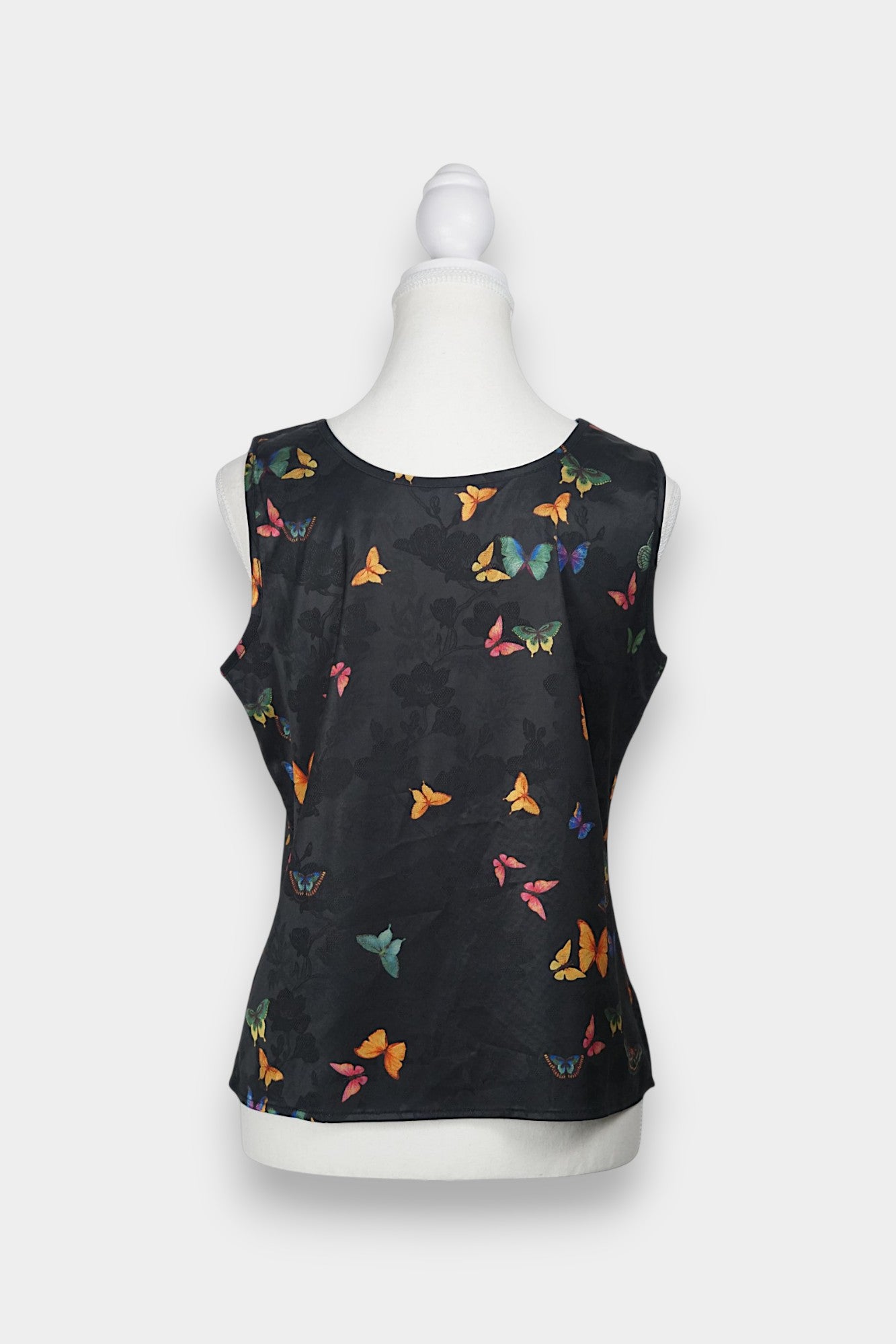 Women's sleeveless top made from dark Xiangyun Sha (Gambiered Silk), featuring a mandarin collar and unique matte sheen