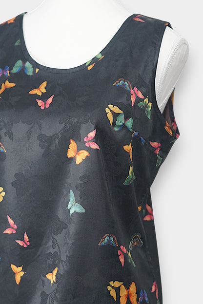 Women's sleeveless top made from dark Xiangyun Sha (Gambiered Silk), featuring a mandarin collar and unique matte sheen