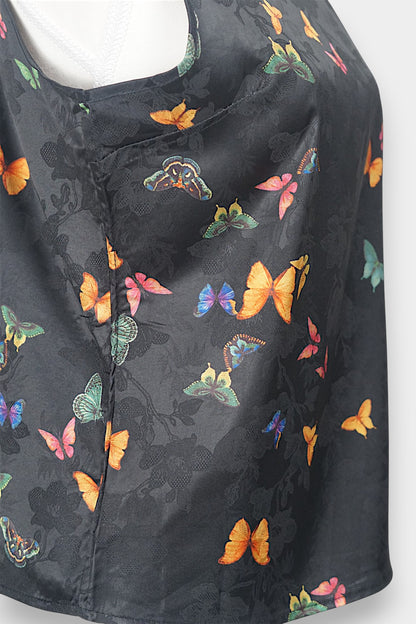 Women's sleeveless top made from dark Xiangyun Sha (Gambiered Silk), featuring a mandarin collar and unique matte sheen