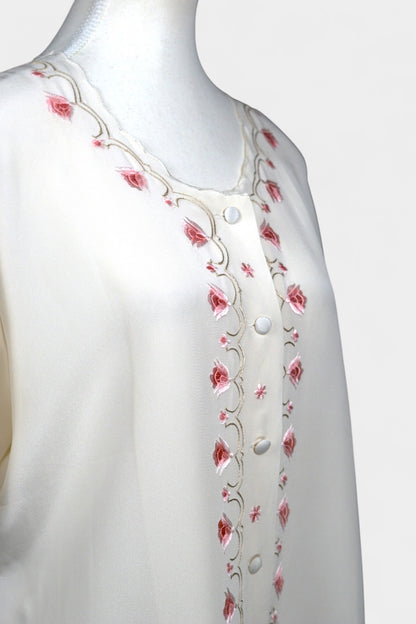Cream silk short-sleeve blouse featuring pink floral embroidery and scalloped edges