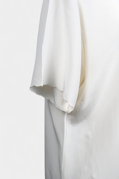 Cream silk short-sleeve blouse featuring pink floral embroidery and scalloped edges