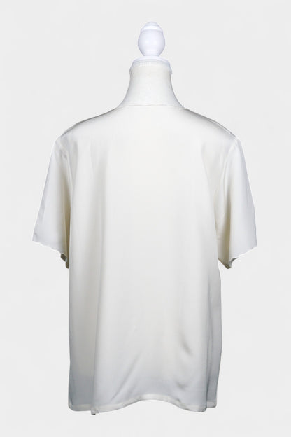 Cream silk short-sleeve blouse featuring pink floral embroidery and scalloped edges