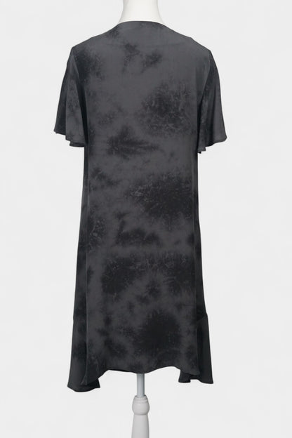 Women's black and grey patterned silk dress with a bow neckline and short flutter sleeves on a mannequin.