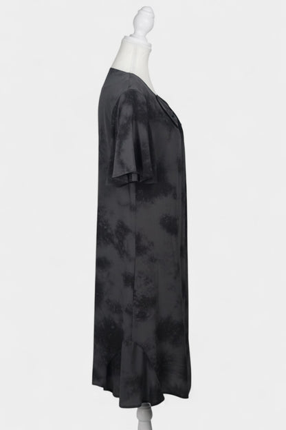 Women's black and grey patterned silk dress with a bow neckline and short flutter sleeves on a mannequin.