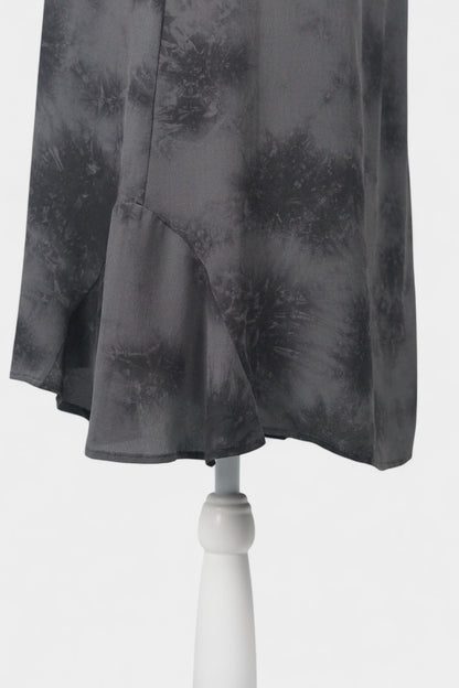 Women's black and grey patterned silk dress with a bow neckline and short flutter sleeves on a mannequin.