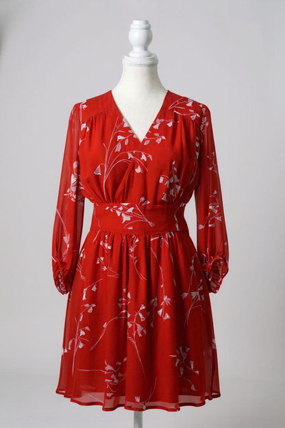 Women's red silk dress with white floral print, featuring a V-neck, wide waistband, and long sheer sleeves