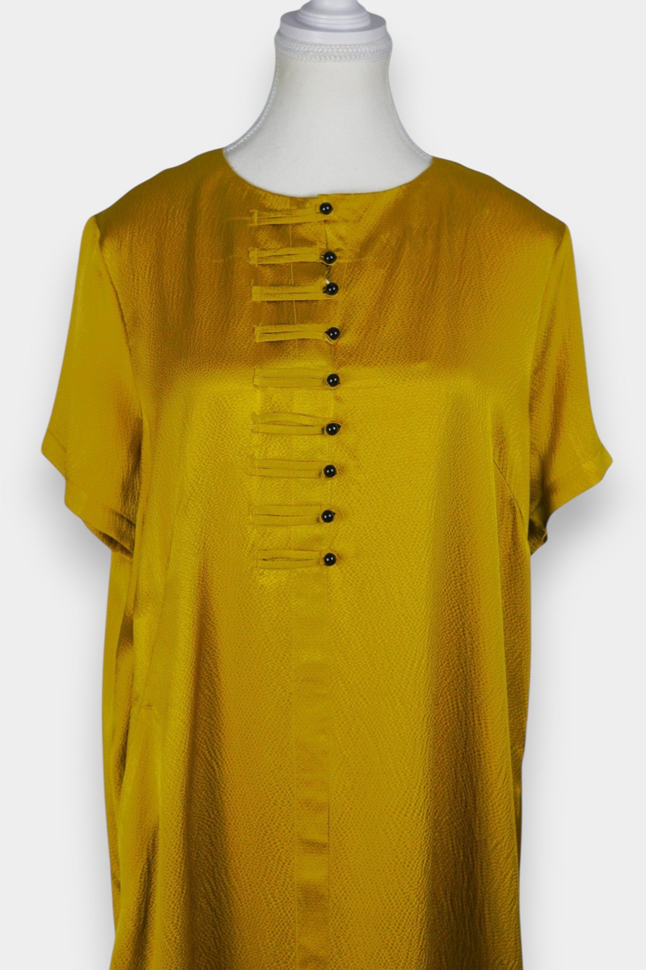 Mustard yellow midi shift dress featuring unique horizontal loop button detailing on the chest