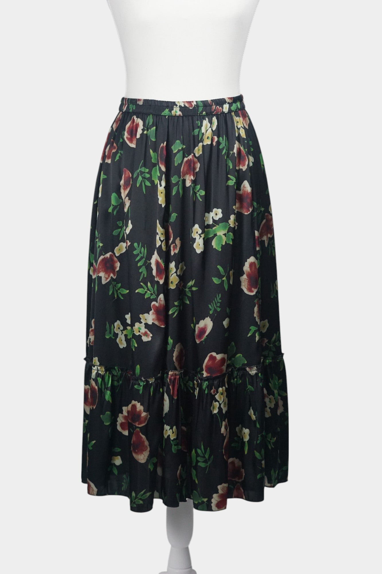 Black floral silk midi skirt with elastic waistband and tiered ruffle hem
