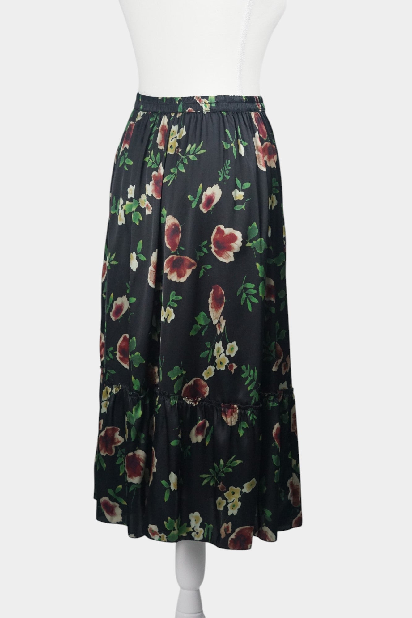 Black floral silk midi skirt with elastic waistband and tiered ruffle hem