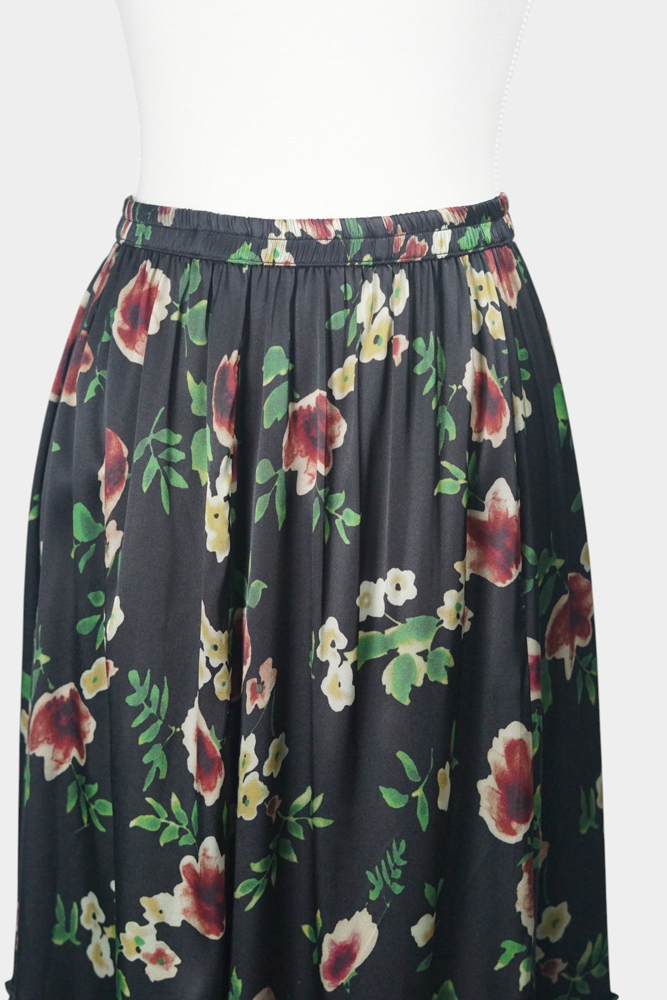 Black floral silk midi skirt with elastic waistband and tiered ruffle hem
