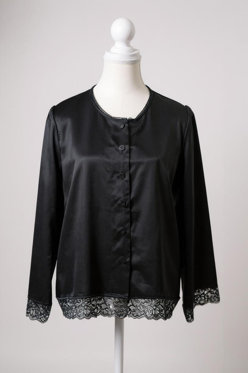 Black silk jacket featuring delicate lace trim on cuffs and hem, with button-down front