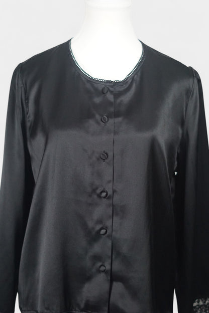 Black silk jacket featuring delicate lace trim on cuffs and hem, with button-down front
