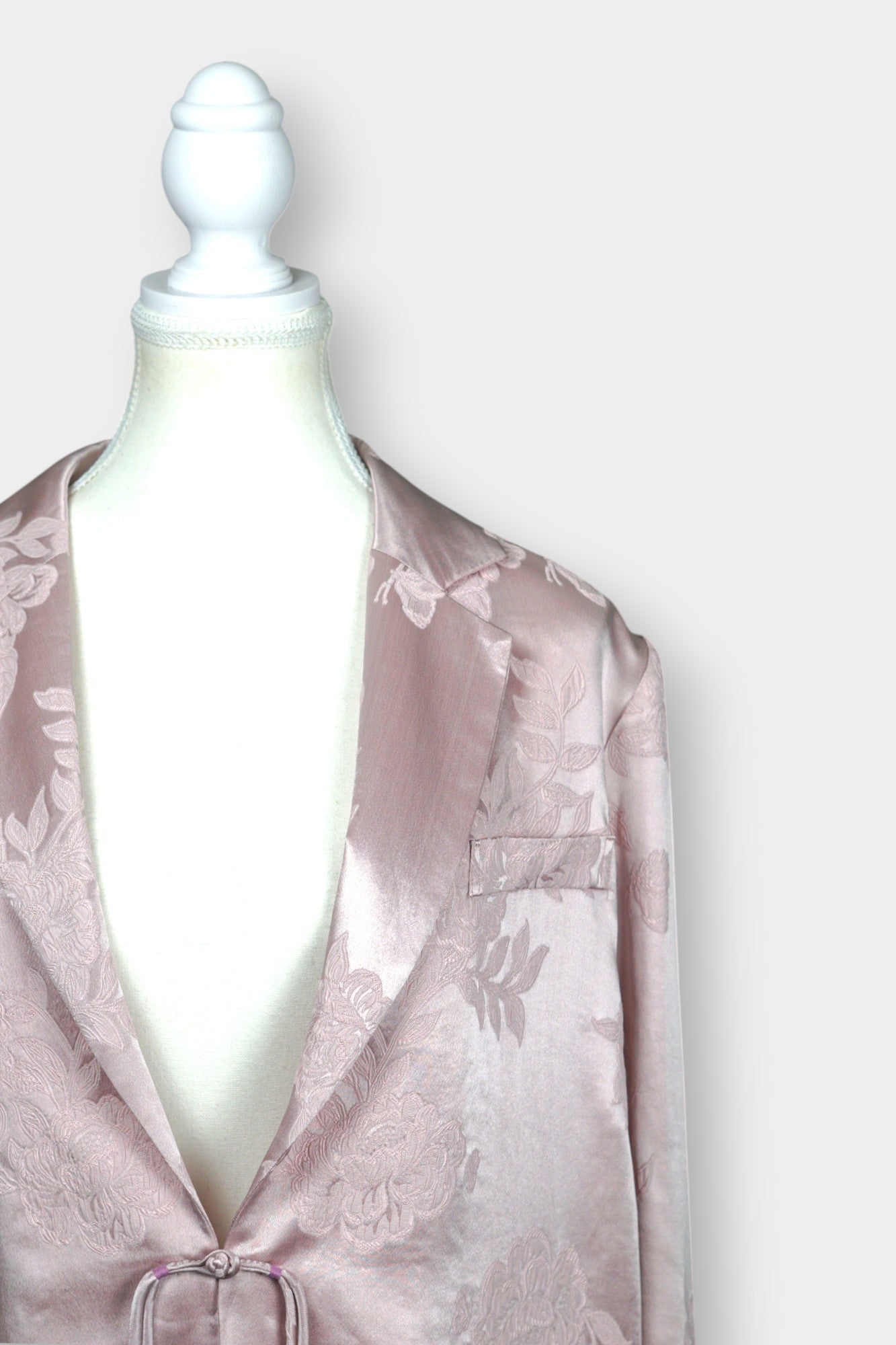 Dusty pink silk jacquard blazer featuring floral pattern and ribbon tie-front closure
