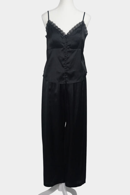 Black silk two-piece set featuring a lace-trimmed camisole top with button details and matching wide-leg trousers.