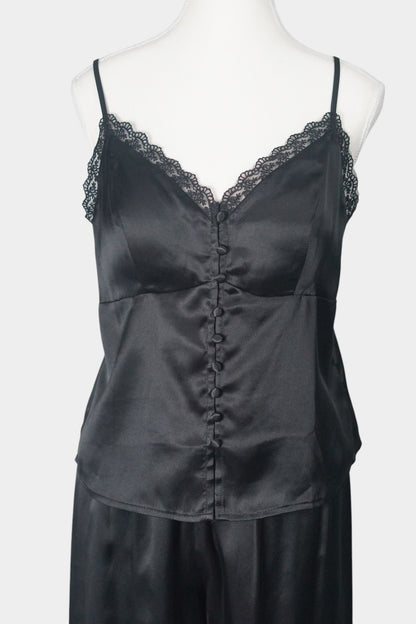Black silk two-piece set featuring a lace-trimmed camisole top with button details and matching wide-leg trousers.