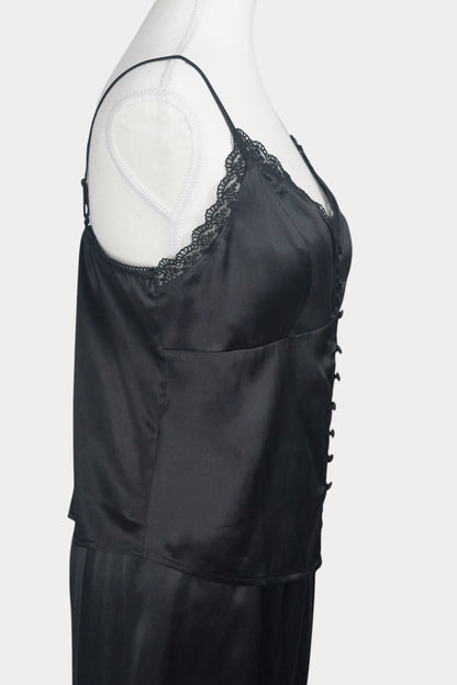 Black silk two-piece set featuring a lace-trimmed camisole top with button details and matching wide-leg trousers.