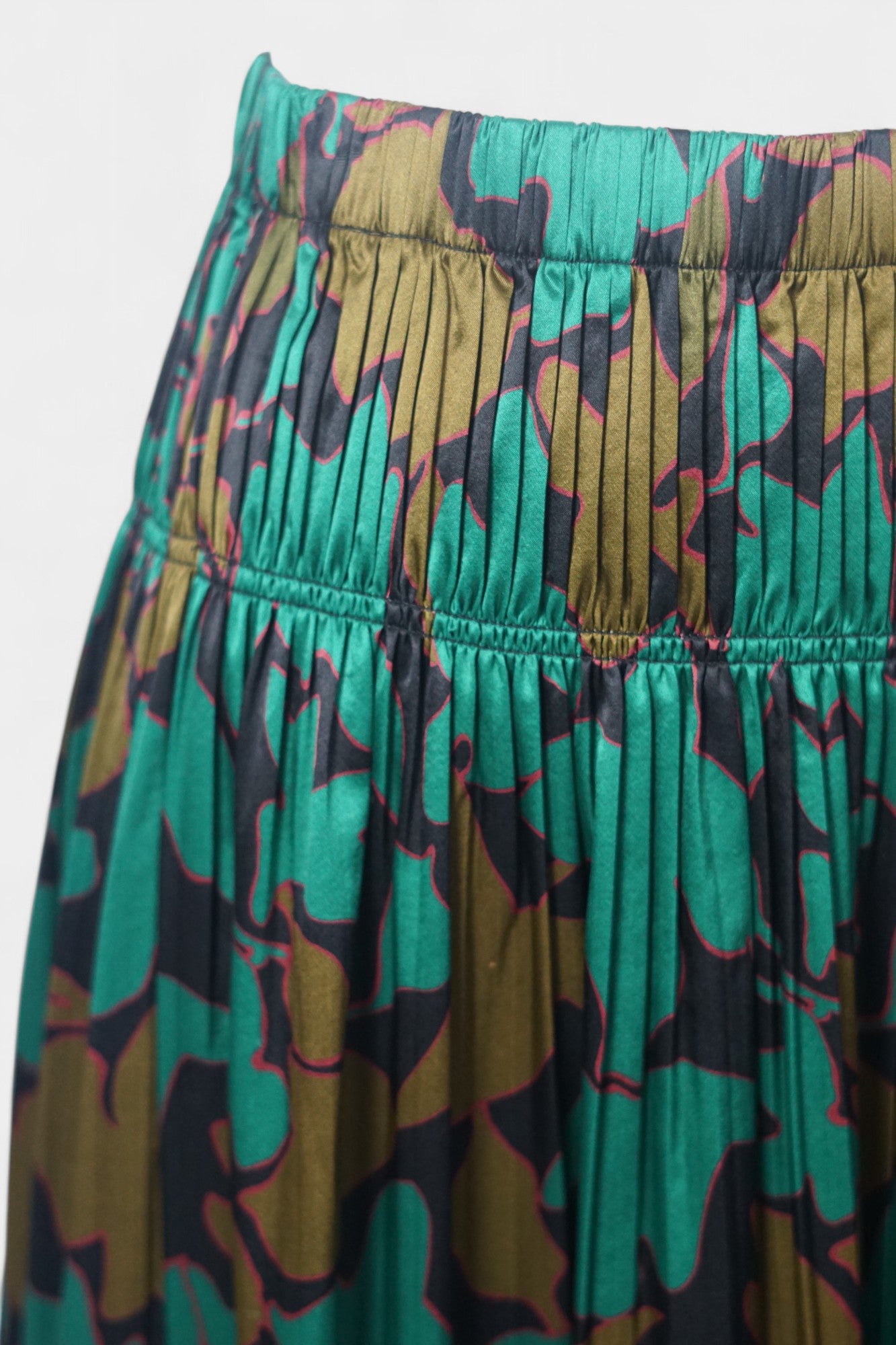Flowy A-line skirt with smocked waist in lustrous green and copper abstract design
