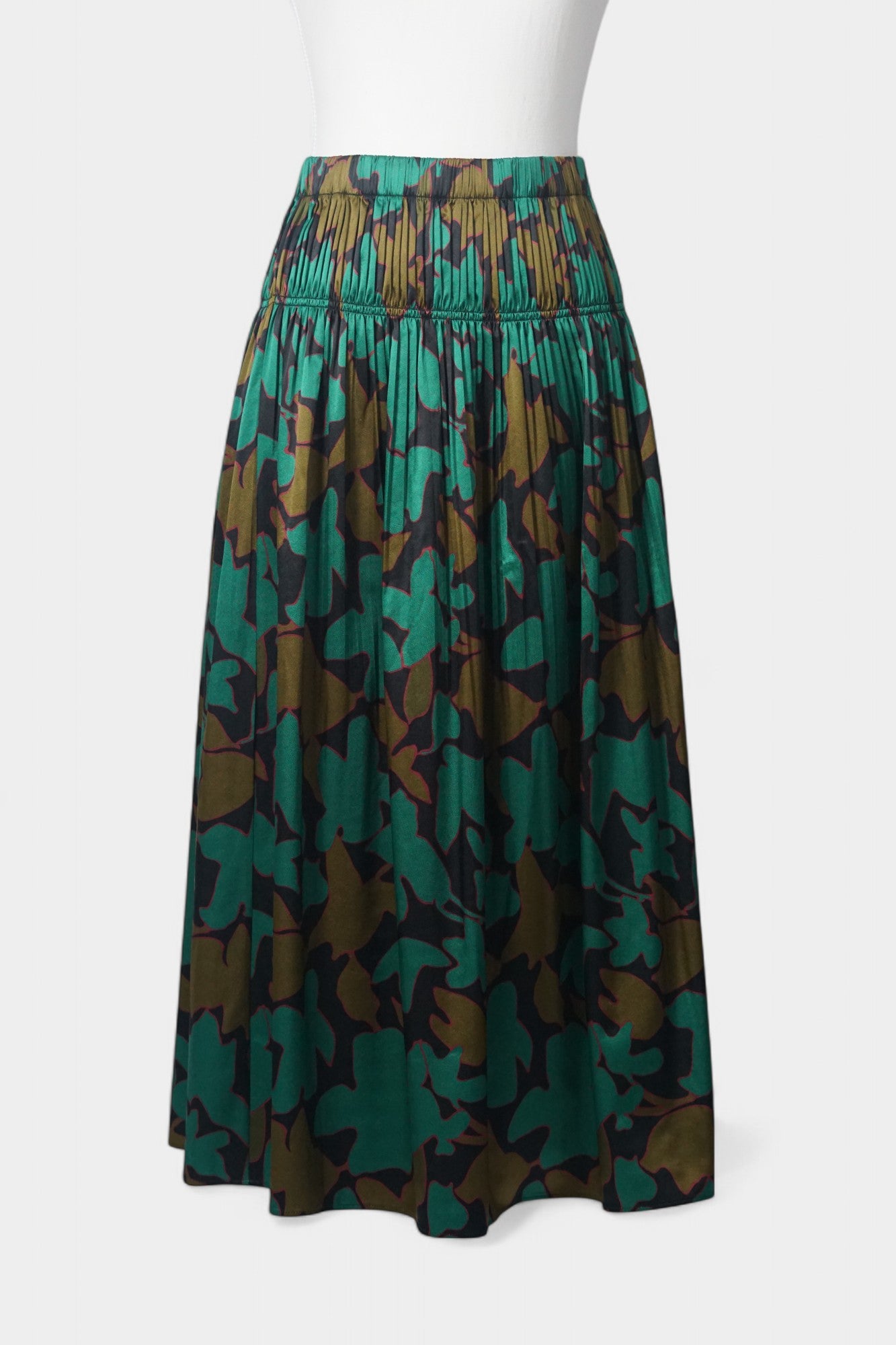 Flowy A-line skirt with smocked waist in lustrous green and copper abstract design