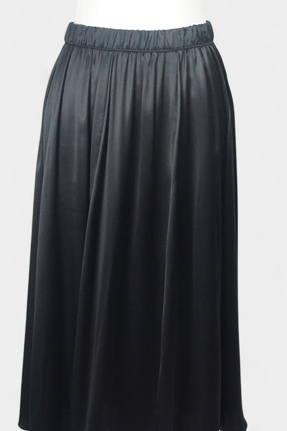 Solid black silk midi skirt featuring a comfortable elastic waistband and gathered A-line silhouette