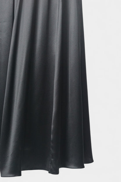 Solid black silk midi skirt featuring a comfortable elastic waistband and gathered A-line silhouette