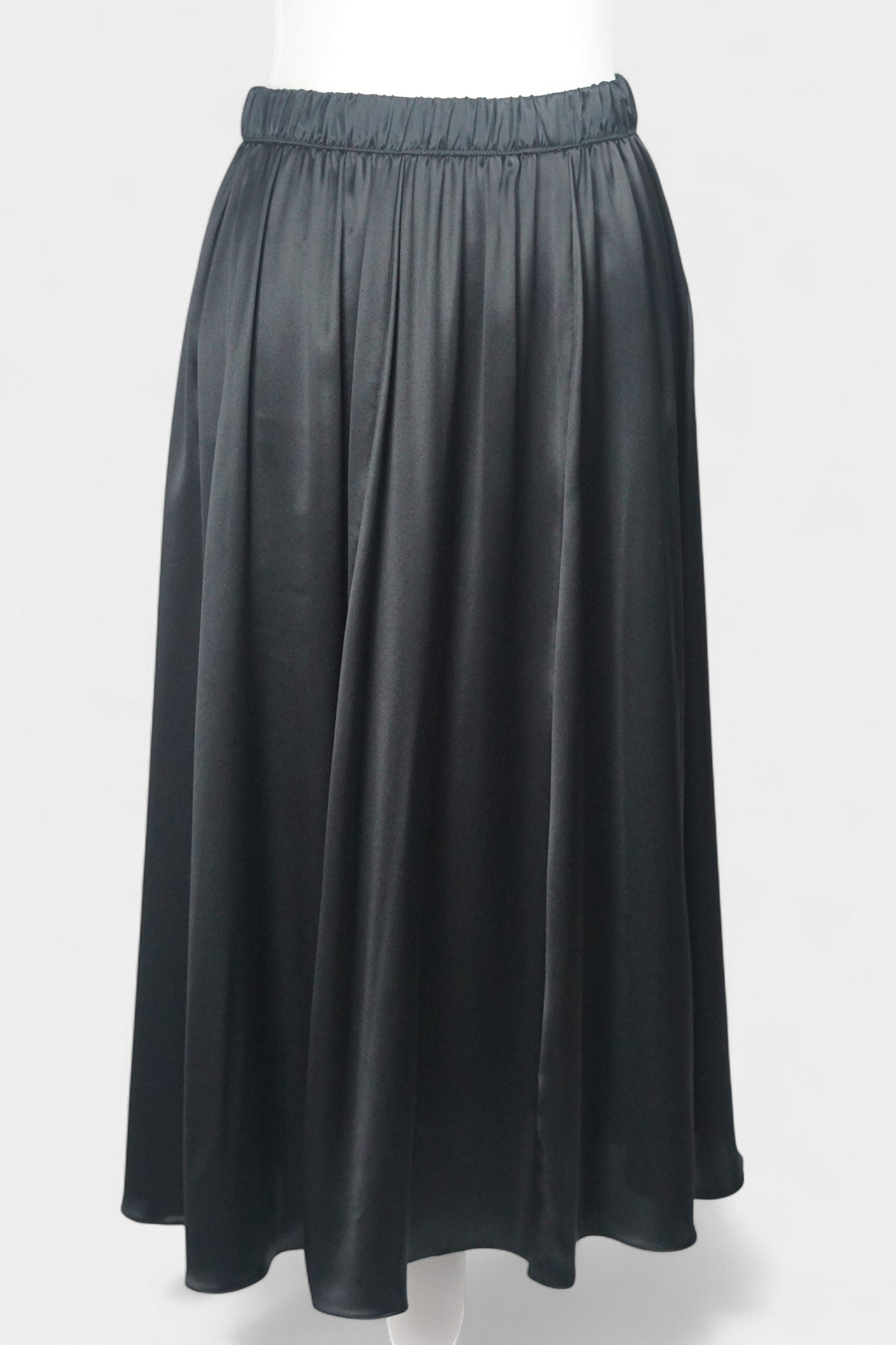 Solid black silk midi skirt featuring a comfortable elastic waistband and gathered A-line silhouette