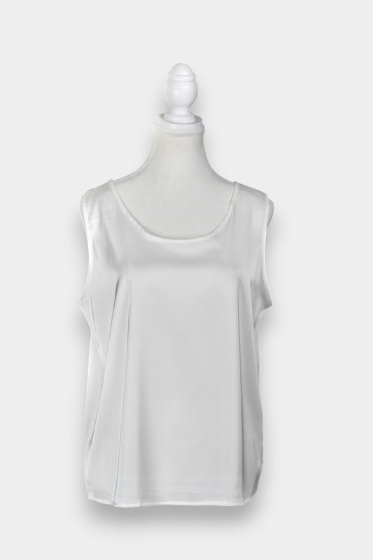 Women's white sleeveless silk top with a scoop neckline on a mannequin.