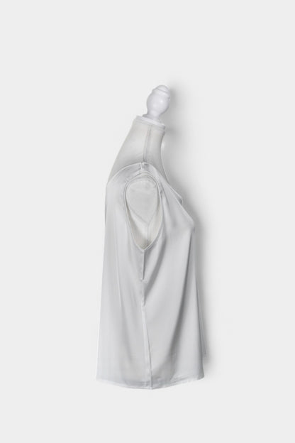 Women's white sleeveless silk top with a scoop neckline on a mannequin.