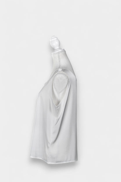 Women's white sleeveless silk top with a scoop neckline on a mannequin.