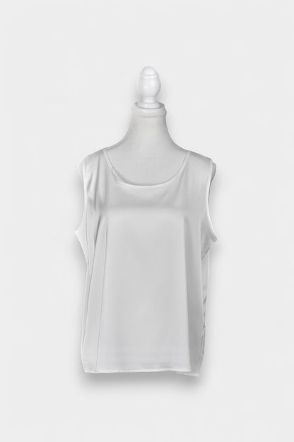 Women's white sleeveless silk top with a scoop neckline on a mannequin.