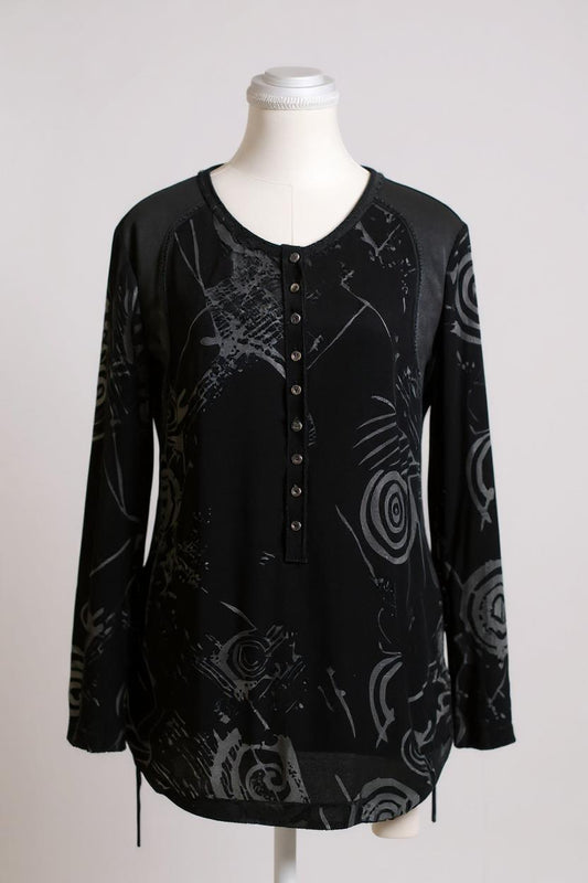 Women's black silk Henley top with grey abstract sketch patterns, buttons, and drawstring hem on a mannequin.