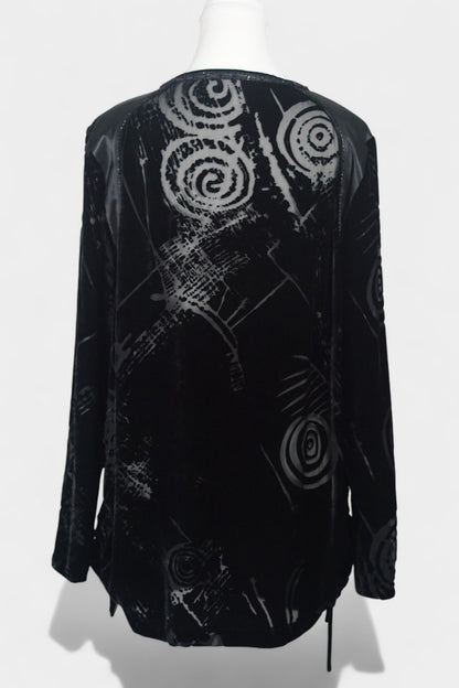 Women's black silk Henley top with grey abstract sketch patterns, buttons, and drawstring hem on a mannequin.