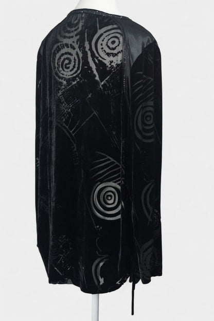 Women's black silk Henley top with grey abstract sketch patterns, buttons, and drawstring hem on a mannequin.