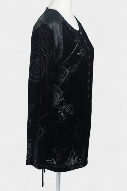Women's black silk Henley top with grey abstract sketch patterns, buttons, and drawstring hem on a mannequin.