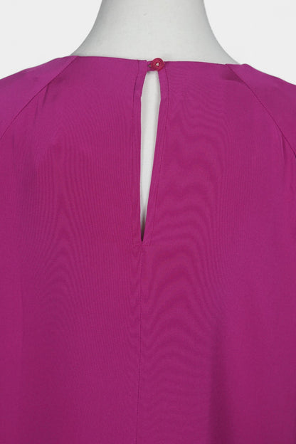 Women's short-sleeve magenta silk top with a round neck and raglan sleeves on a mannequin.