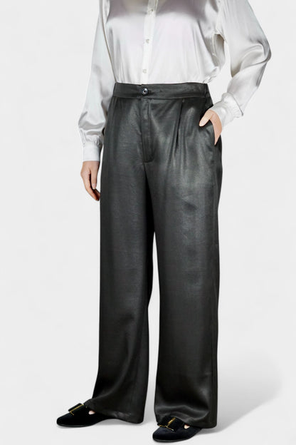Black wide-leg silk trousers with side pockets and a luxurious satin finish.