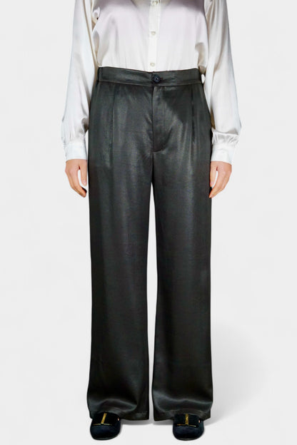 Black wide-leg silk trousers with side pockets and a luxurious satin finish.