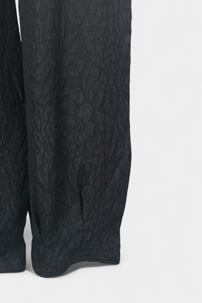 Black textured silk lantern pants with high elastic waistband and tapered ankles
