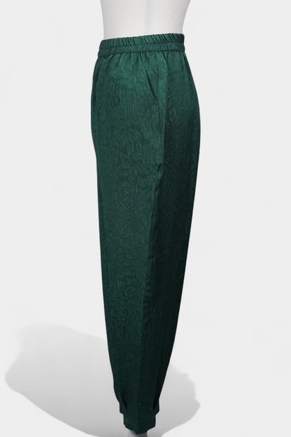 Emerald green textured silk lantern pants with elastic high waistband