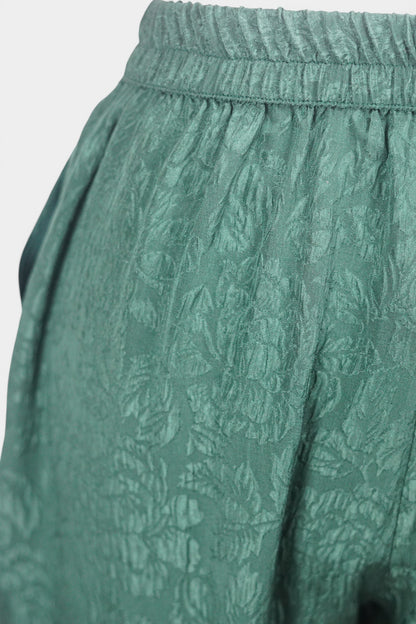 Emerald green textured silk lantern pants with elastic high waistband