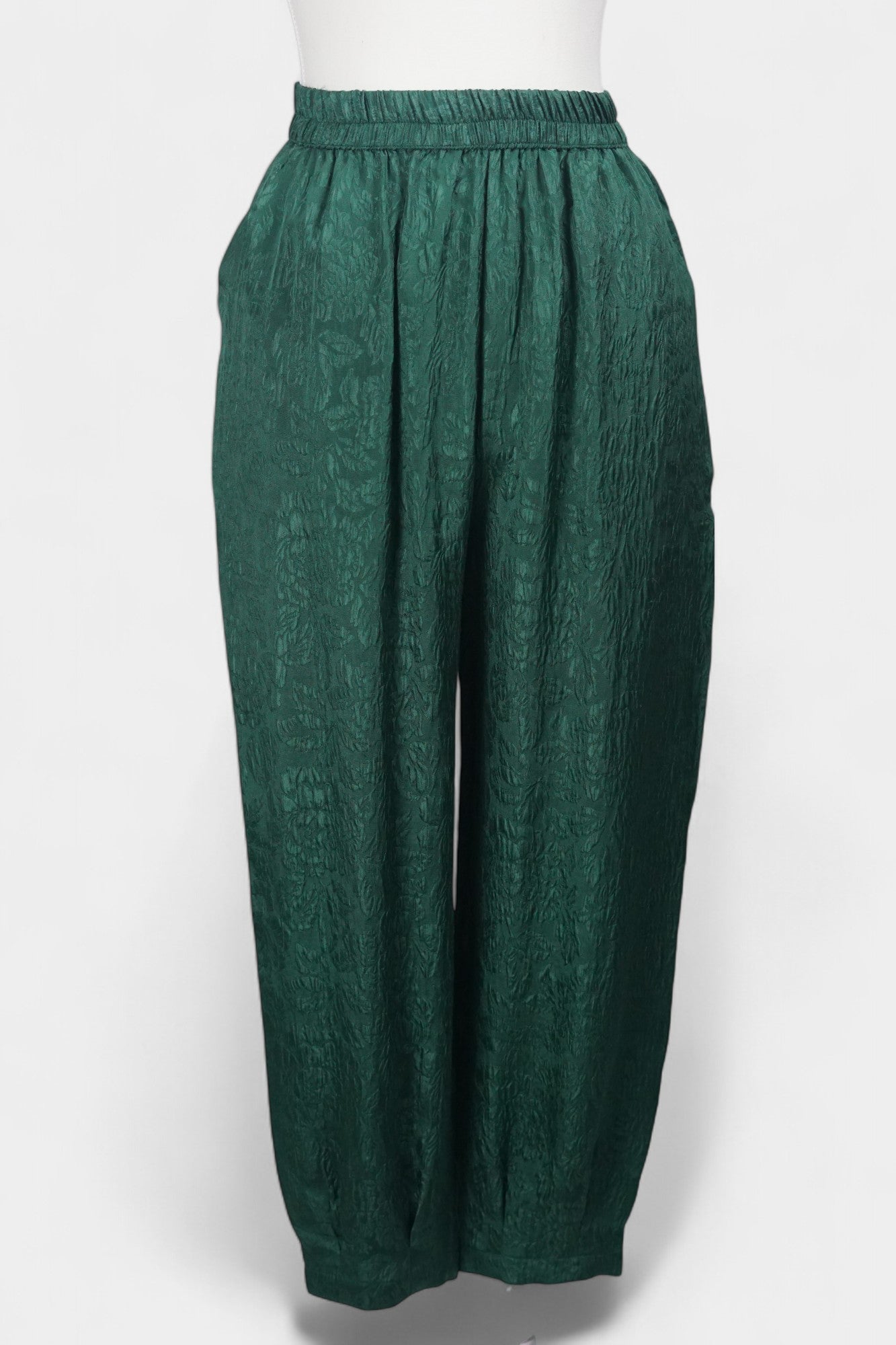 Emerald green textured silk lantern pants with elastic high waistband
