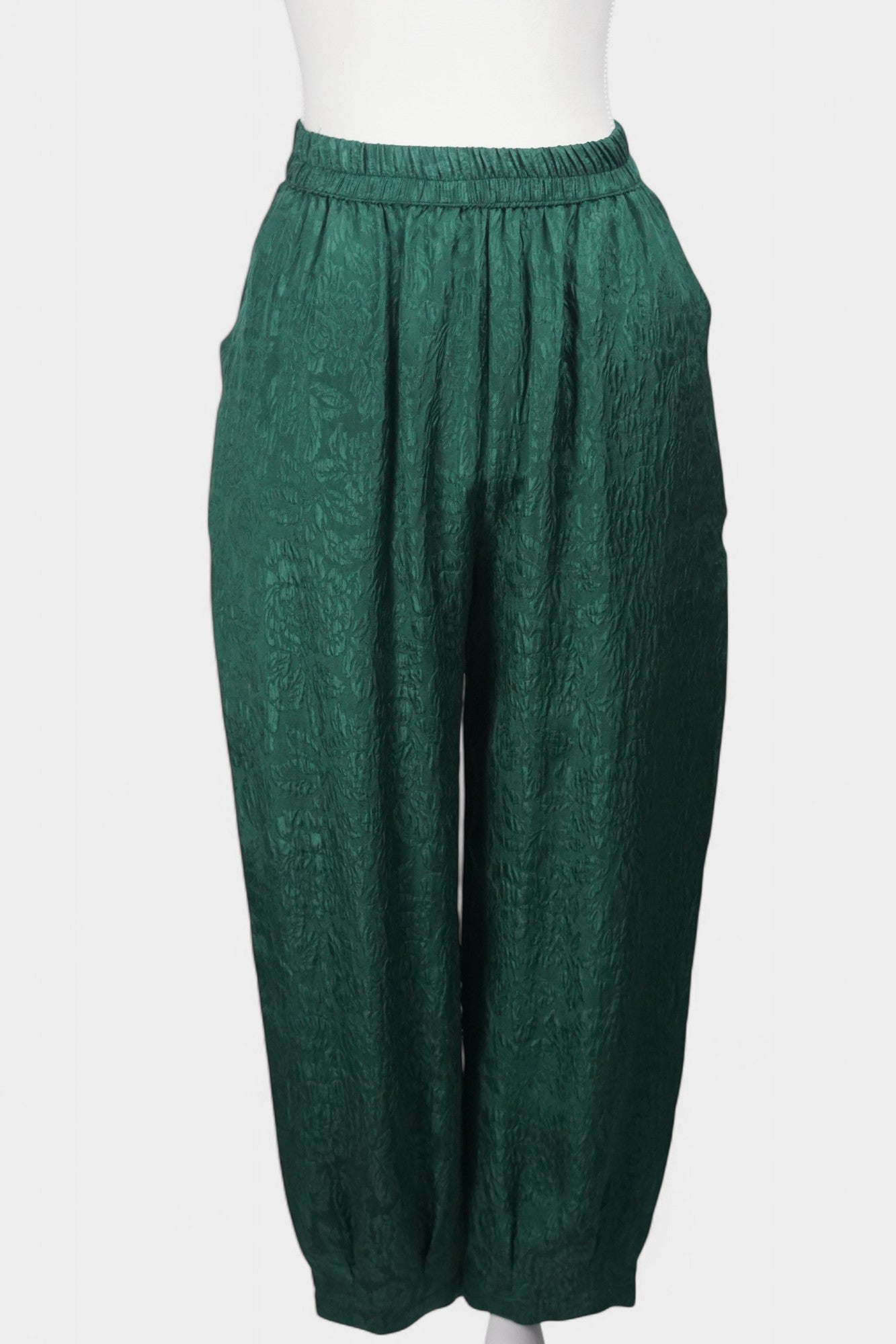 Emerald green textured silk lantern pants with elastic high waistband