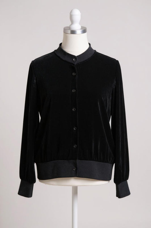 Women's black silk velvet jacket featuring a button-down front, ribbed stand collar, and ribbed cuffs and hem on a mannequin.