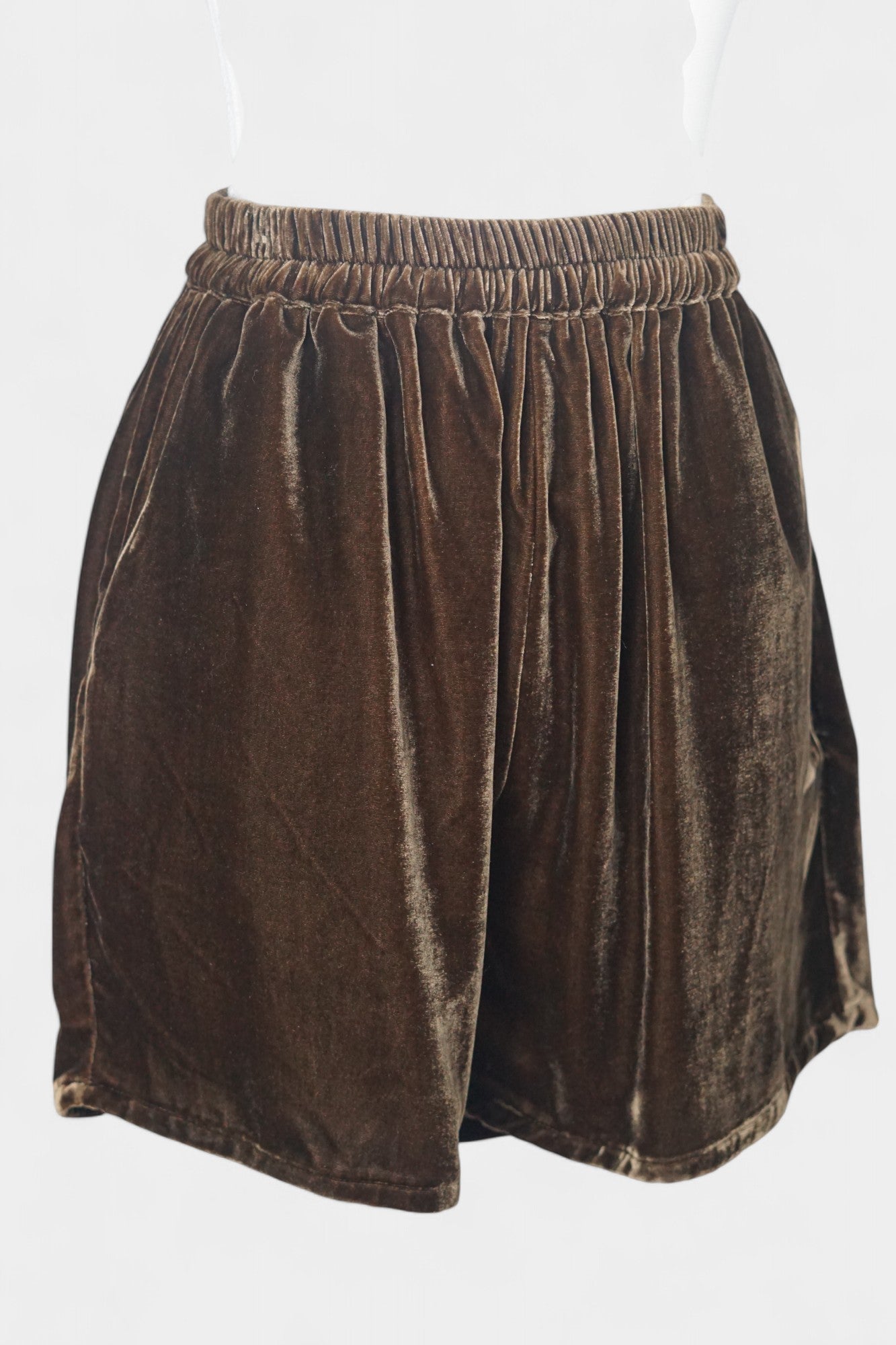 Luxe chocolate silk velvet shorts featuring soft texture and gathered waist.