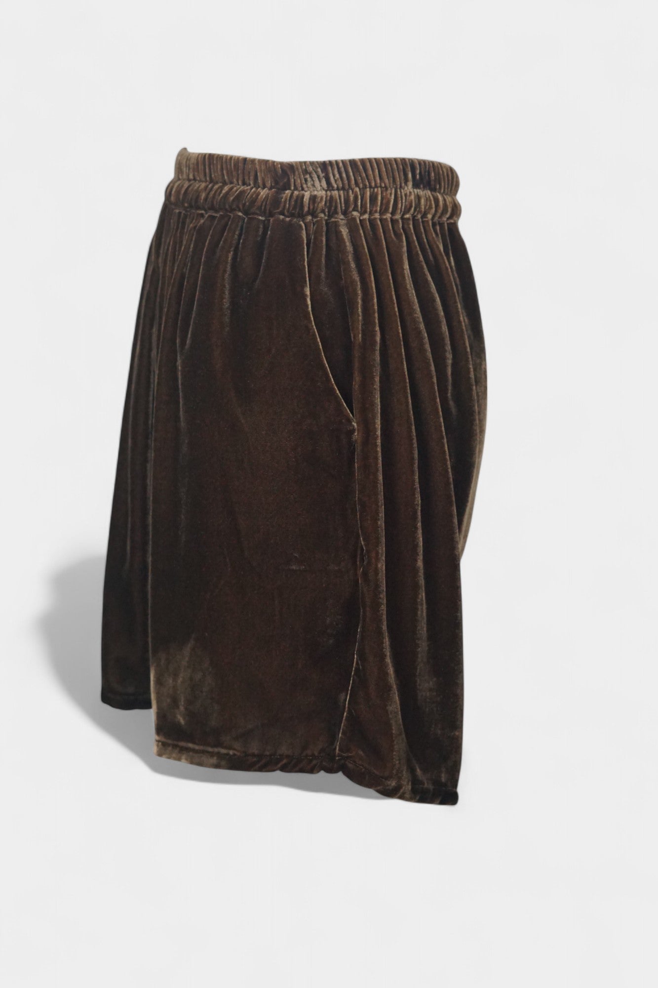 Luxe chocolate silk velvet shorts featuring soft texture and gathered waist.