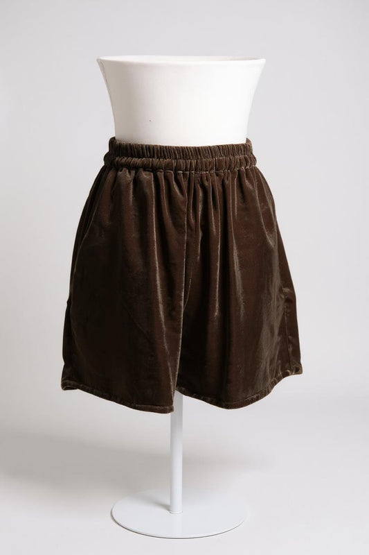 Luxe chocolate silk velvet shorts featuring soft texture and gathered waist.